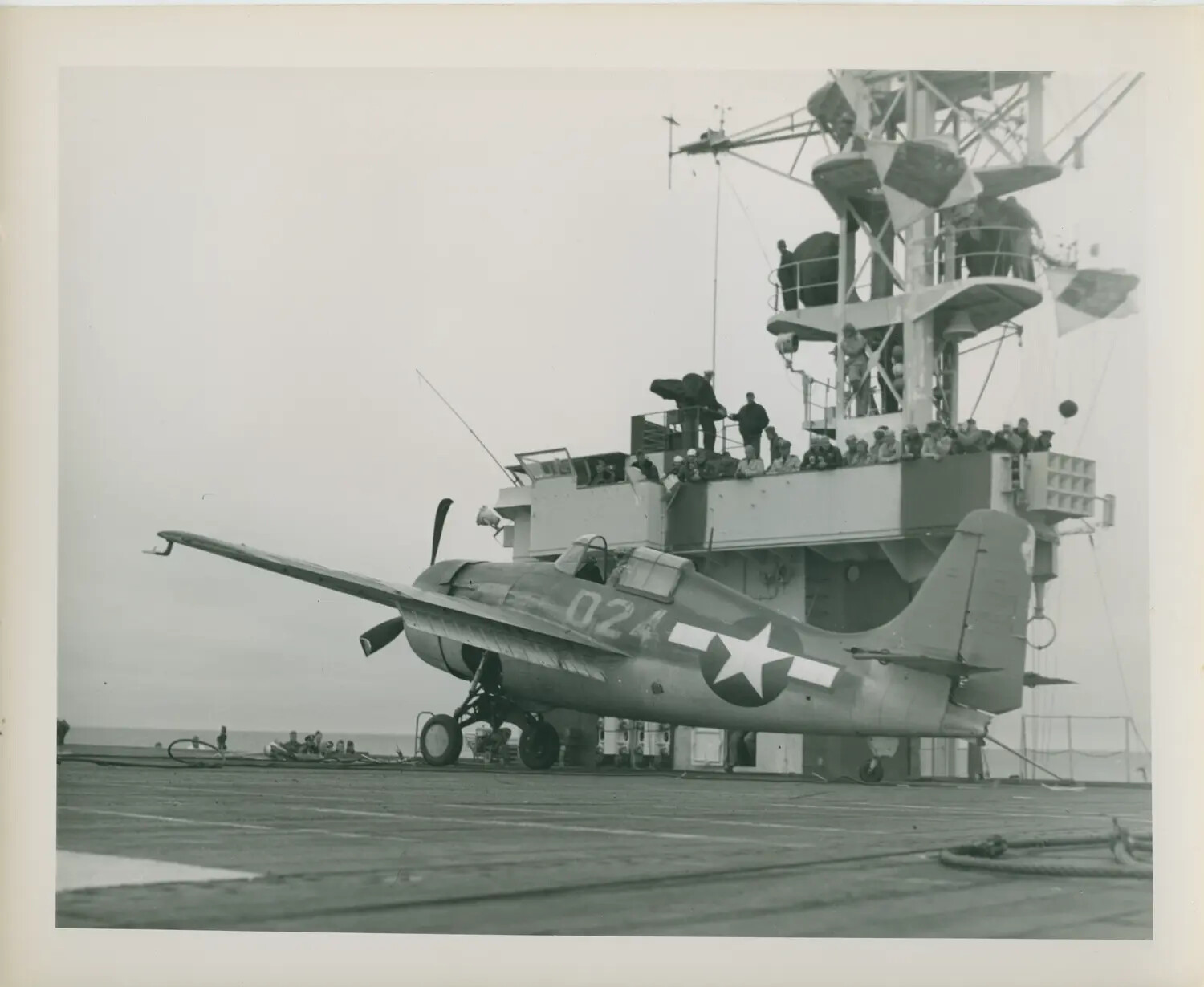 FM-2 Wildcat Fighter Parked Beneath the Island Superstructure, USS Petrof Bay (CVE-80)