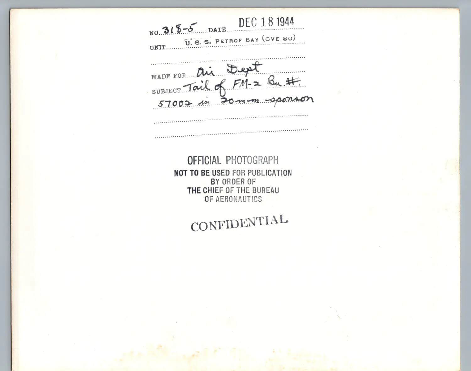 Verso Caption Card of Official U.S. Navy Photograph No. 318-5, U.S.S. Petrof Bay (CVE-80), December 18, 1944