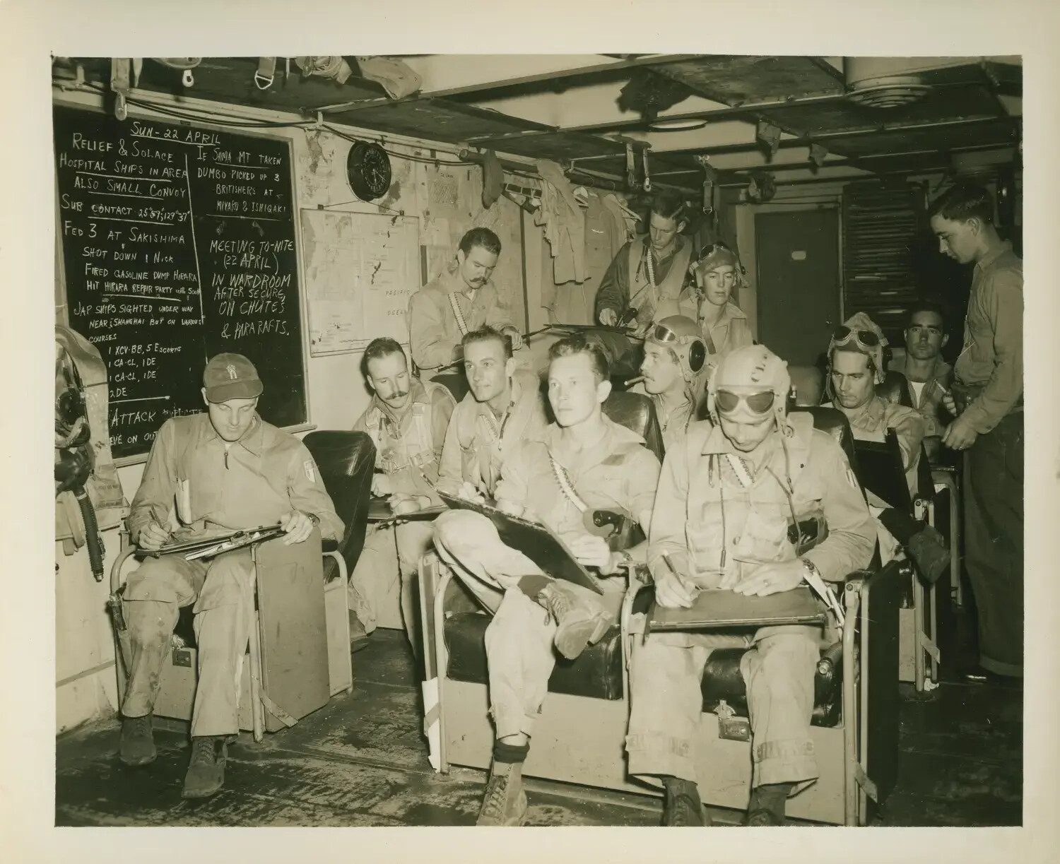 Pilots' Ready Room Briefing Aboard USS Petrof Bay (CVE-80) During Okinawa Campaign, 22 April 1945