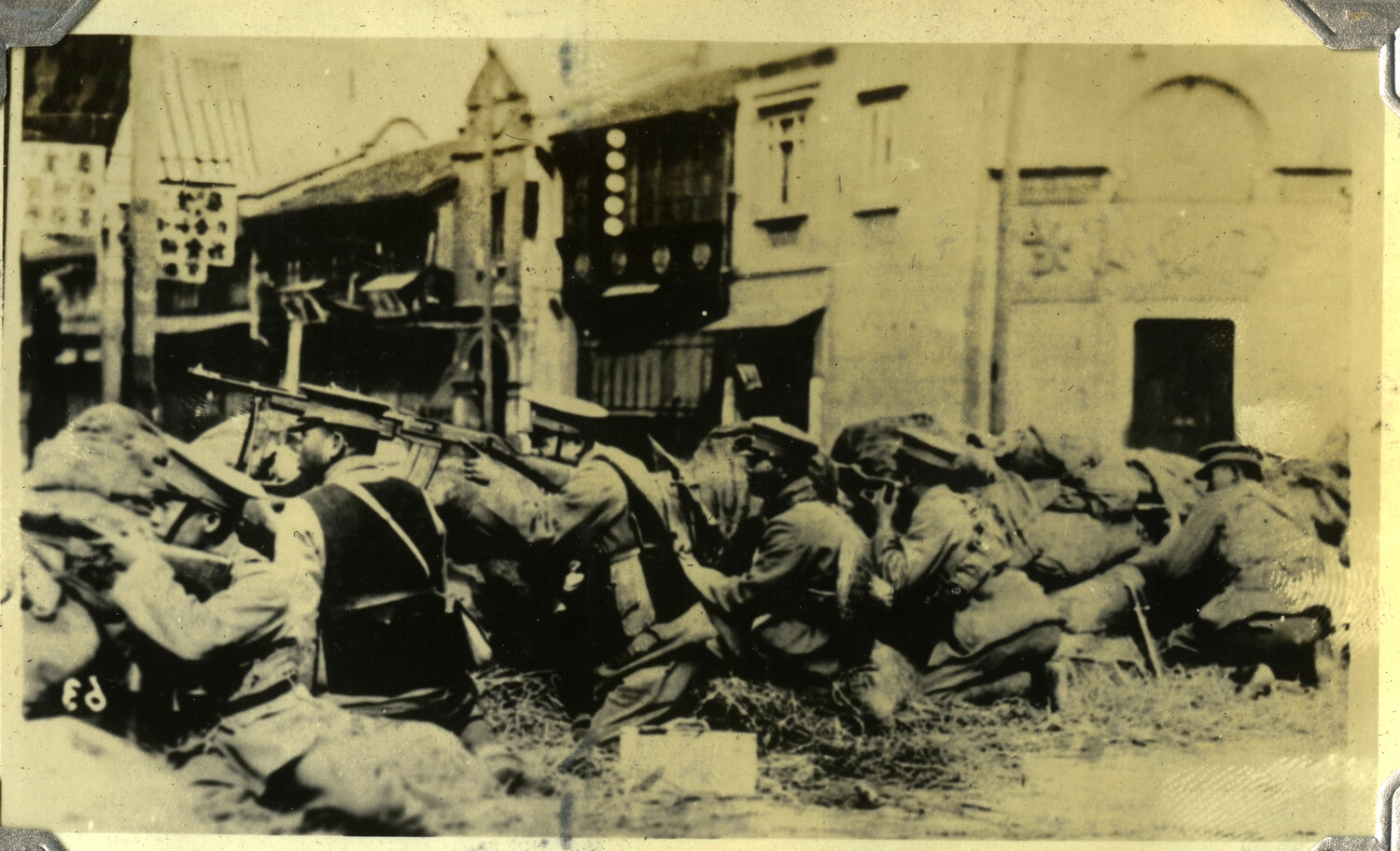 Soldiers Firing from a Sandbagged Barricade in a Chinese City Street, c. 1932-1937