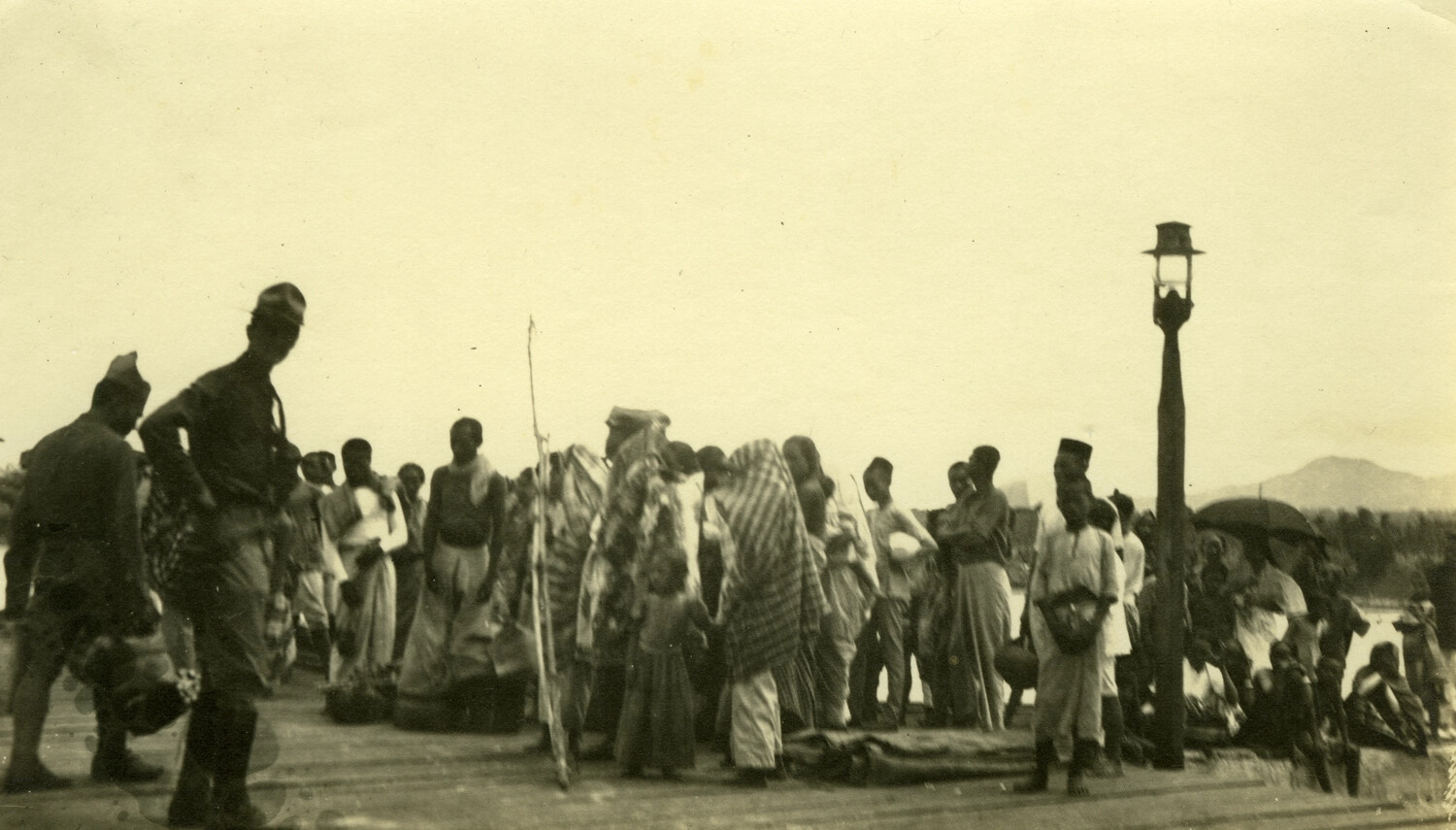 American Soldiers and Filipino Civilians on a Pier, Philippines, Early 1900s