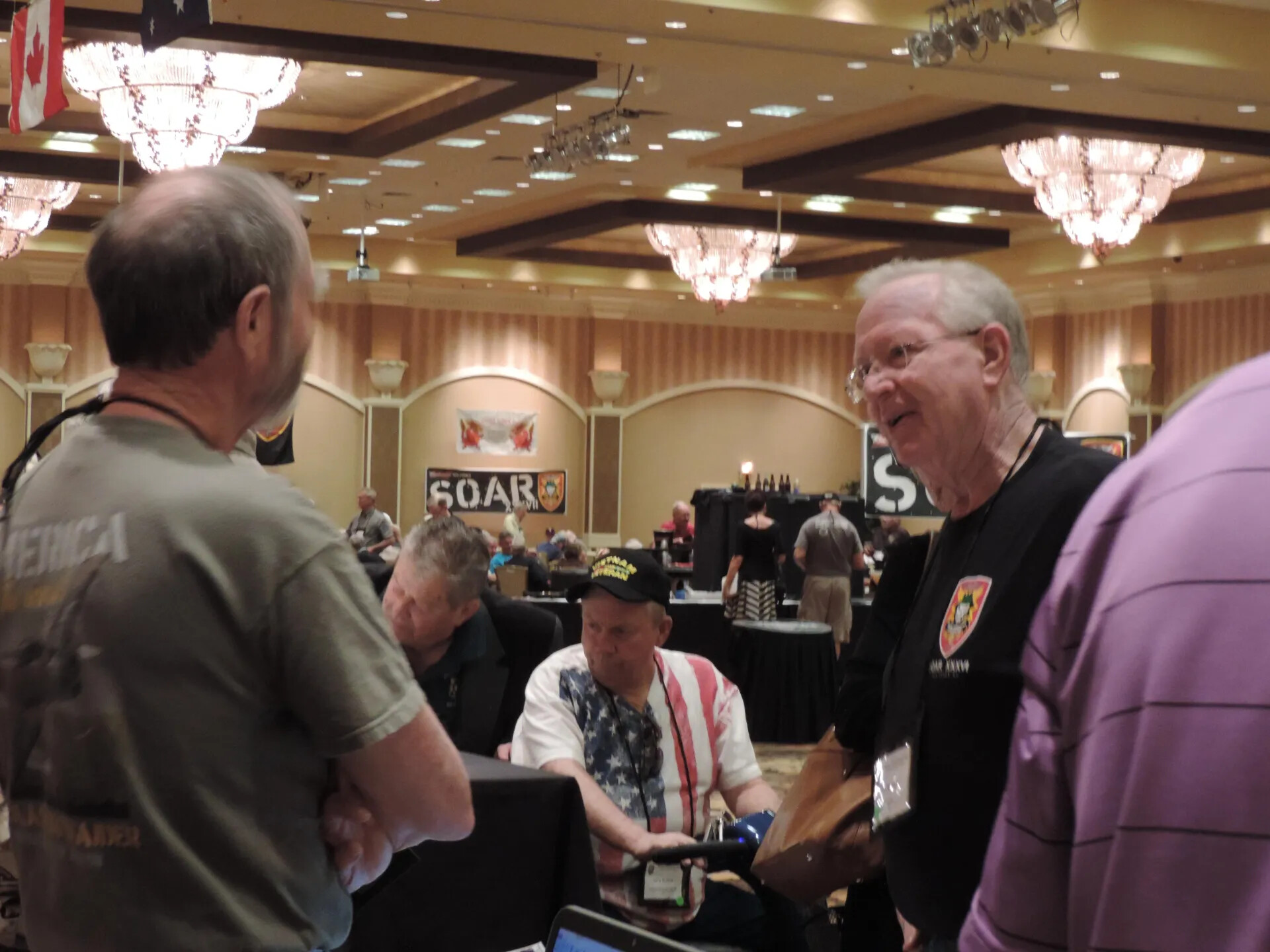 Members Talking Before the SOAR XXXVII Banner, Special Operations Association Reunion, Las Vegas, 2013