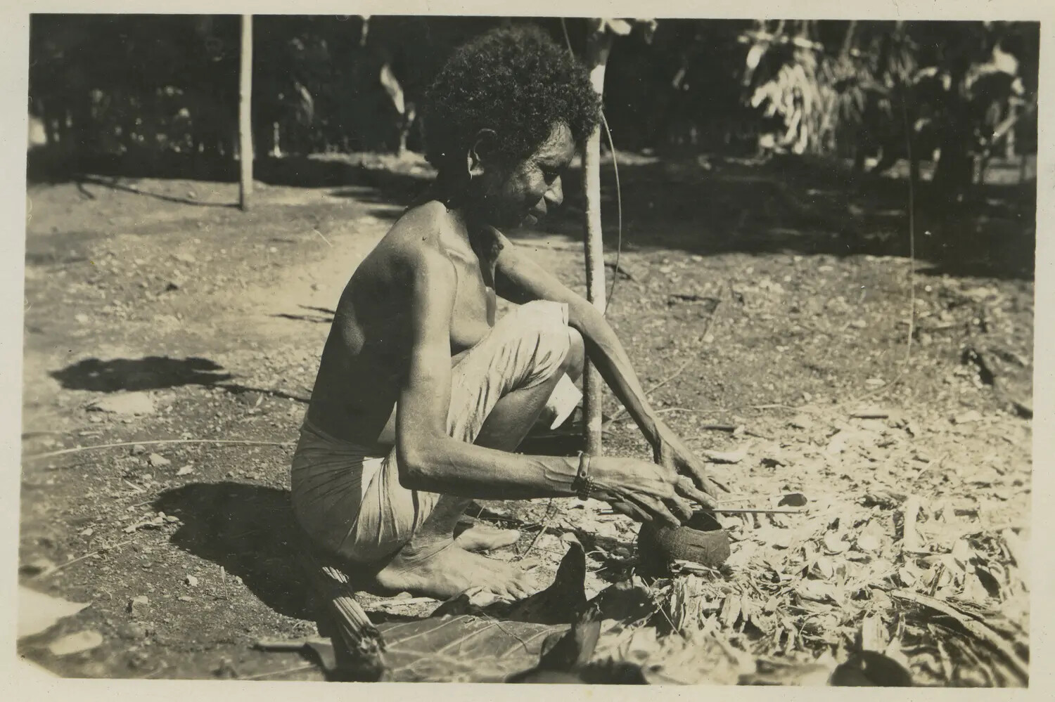 Local Man Engaged in Manual Task, New Guinea, 312th Bombardment Group Collection, WWII