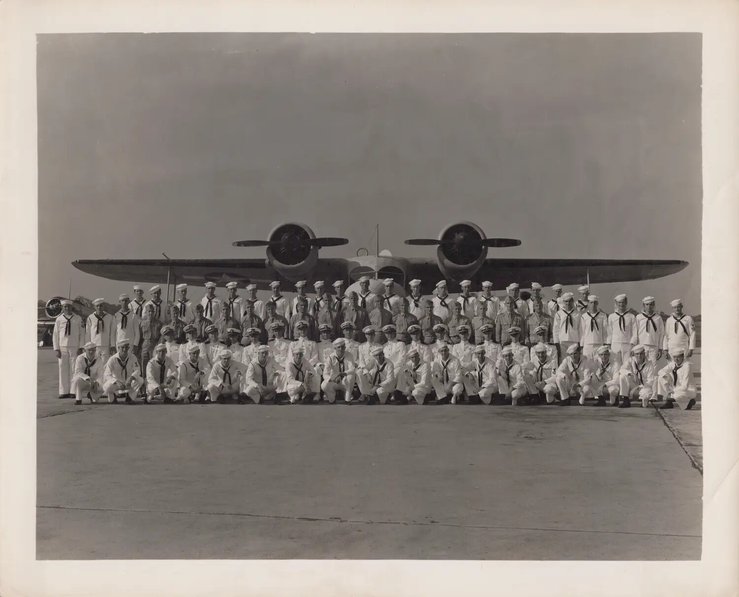 Navy Patrol Squadron Group Photograph in Front of PBY Catalina Flying Boat