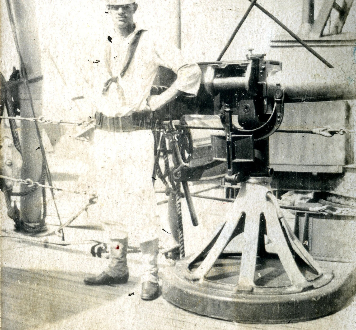 Sailor Posing with a Light Rapid-Fire Gun Aboard USS Columbia (C-12), c. 1898-1907