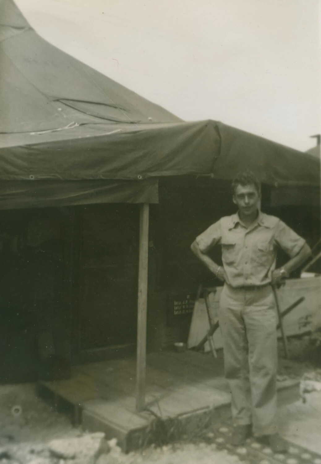 Serviceman Posing Before Squad Tent at Field Encampment, WWII (McAleer Collection)
