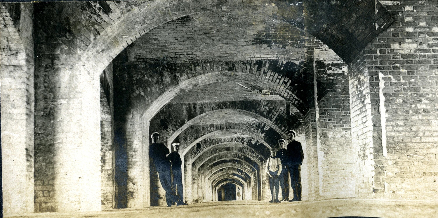 Sailors and Children Inside Brick Casemate Gallery of Coastal Fortification, c. 1898-1910