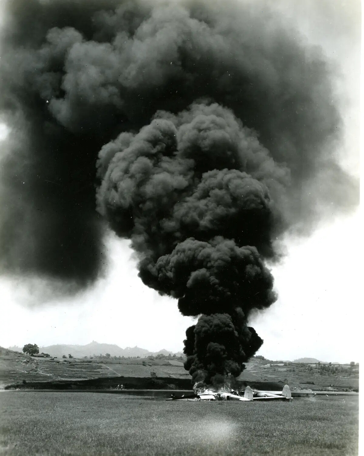 Twin-Engine Aircraft Burning on Airfield, China-Burma-India Theater, WWII