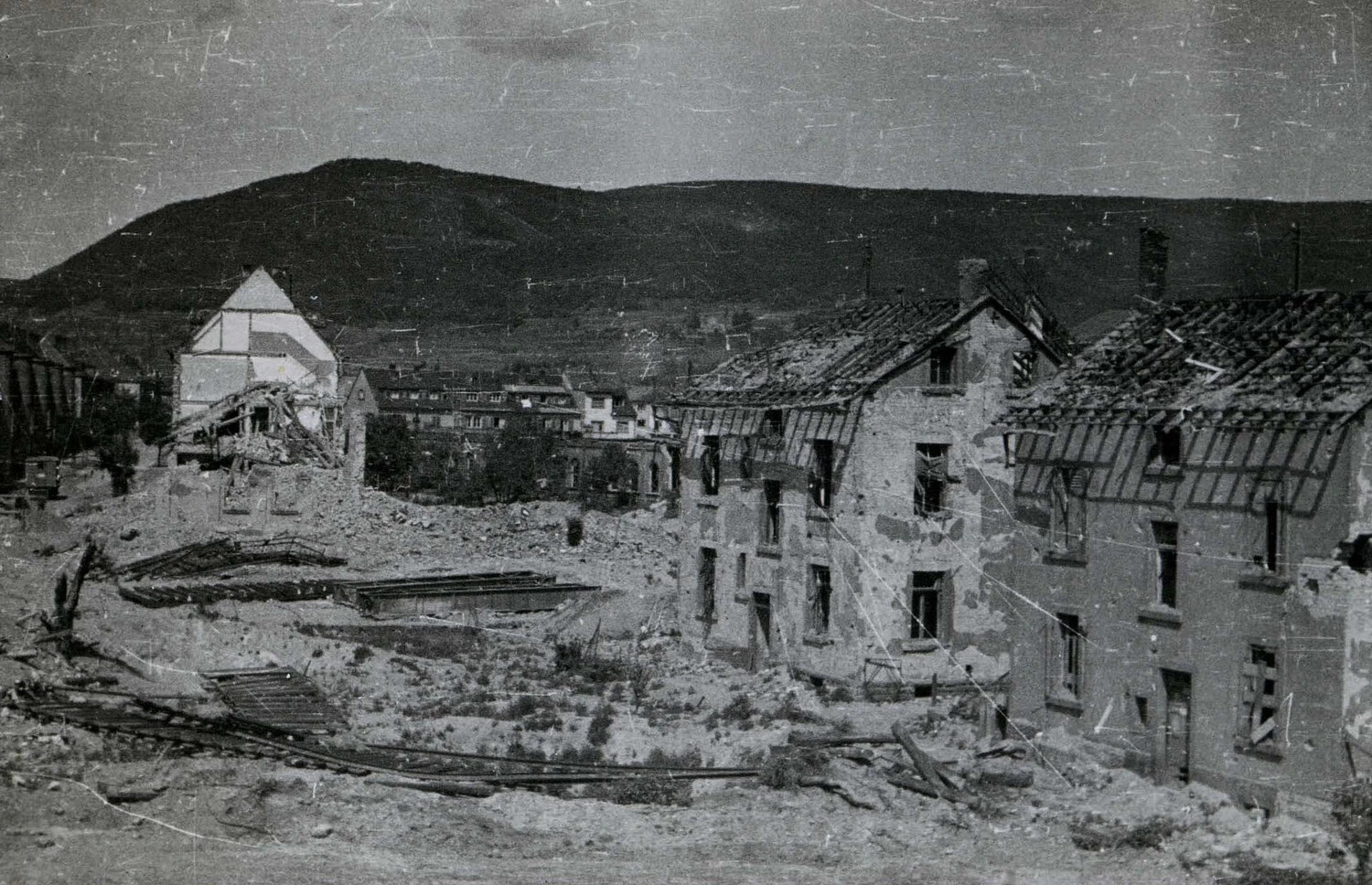 Bomb-Damaged Village in a Valley Beneath Hills, WWII European Theater