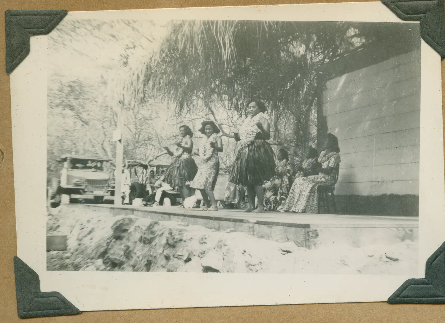 WWII Hawaii Photo Album: Three Hula Dancers Performing, Military Truck in Background