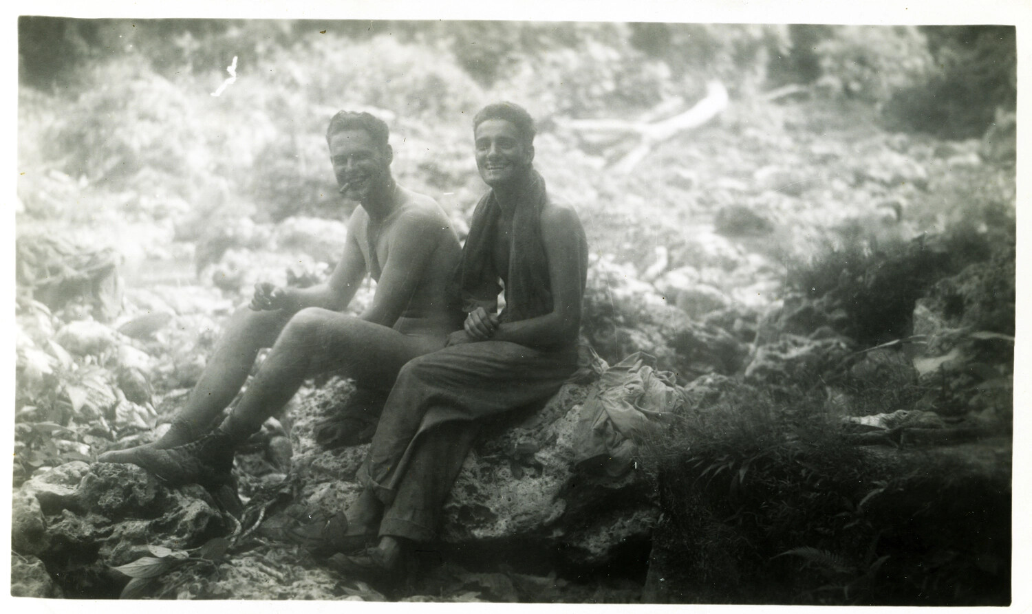 Off-Duty Servicemen Resting on Coral Rocks, Okinawa