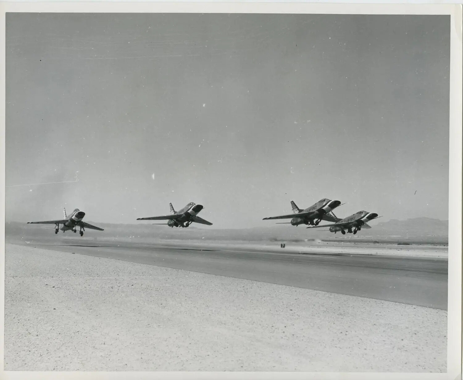 USAF Thunderbirds F-100 Super Sabres Performing Formation Takeoff