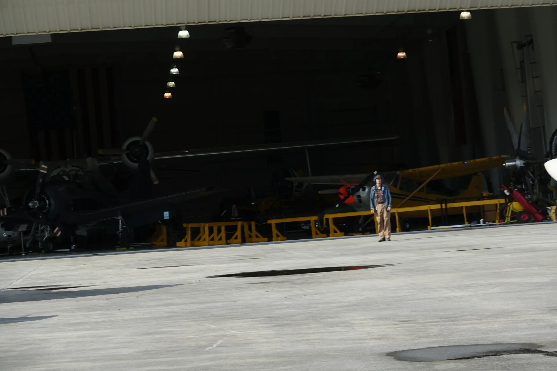 Museum Hangar Interior with Vintage Warbirds and Period-Dressed Pilot Figure, May 2019