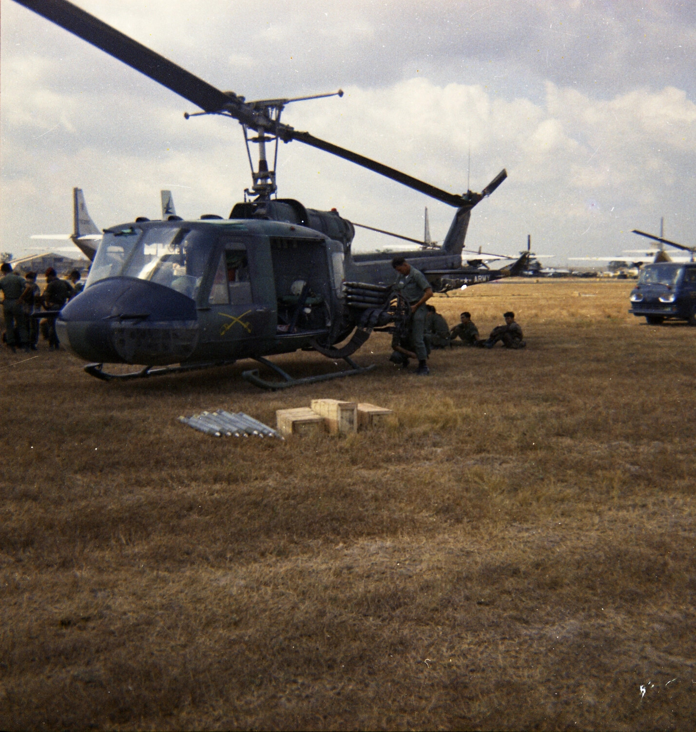 U.S. Army UH-1 'Huey' Gunship Being Armed at Airfield, Vietnam War Era