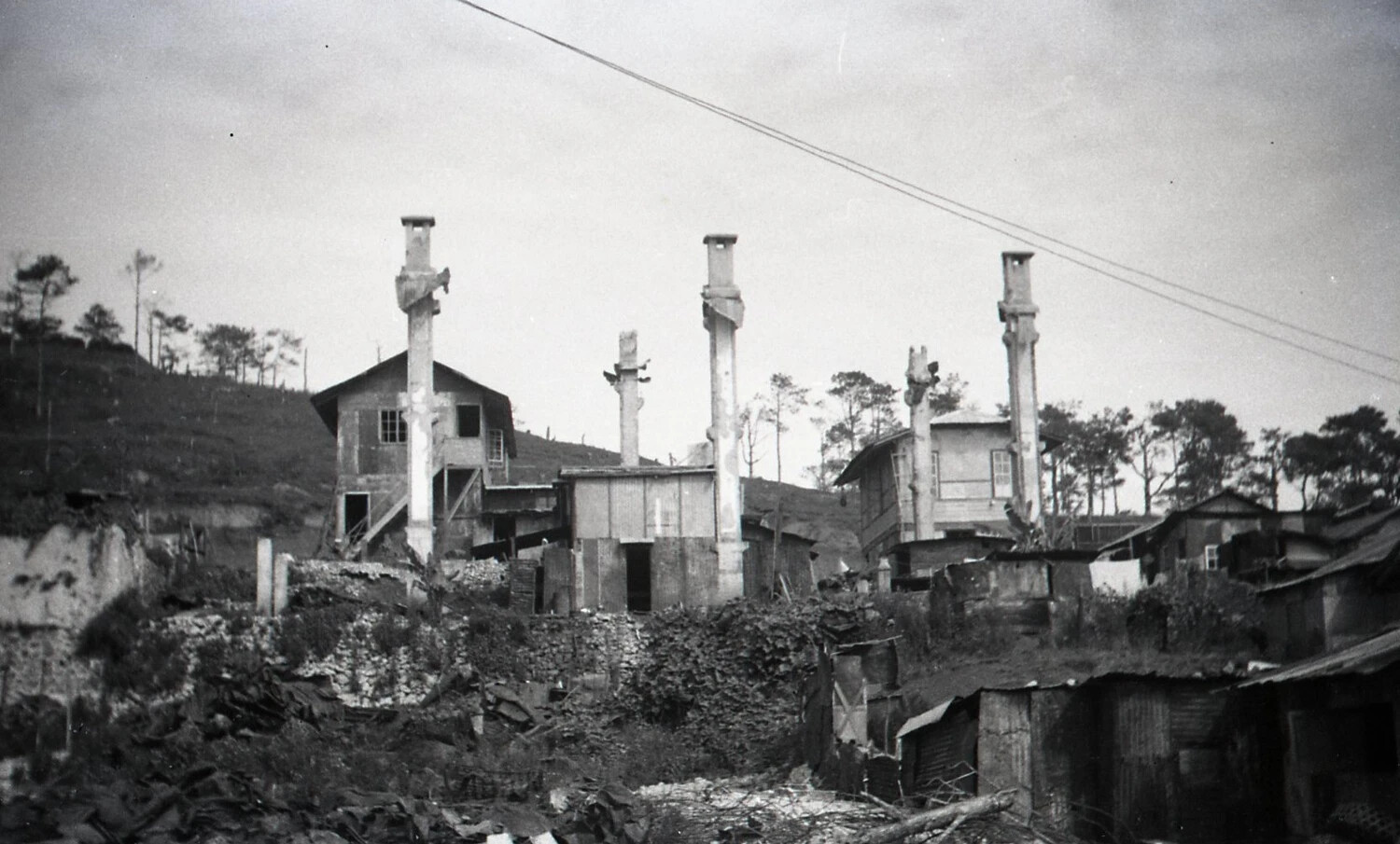 War-Damaged Hillside Town with Surviving Chimneys, Luzon, Philippines, WWII