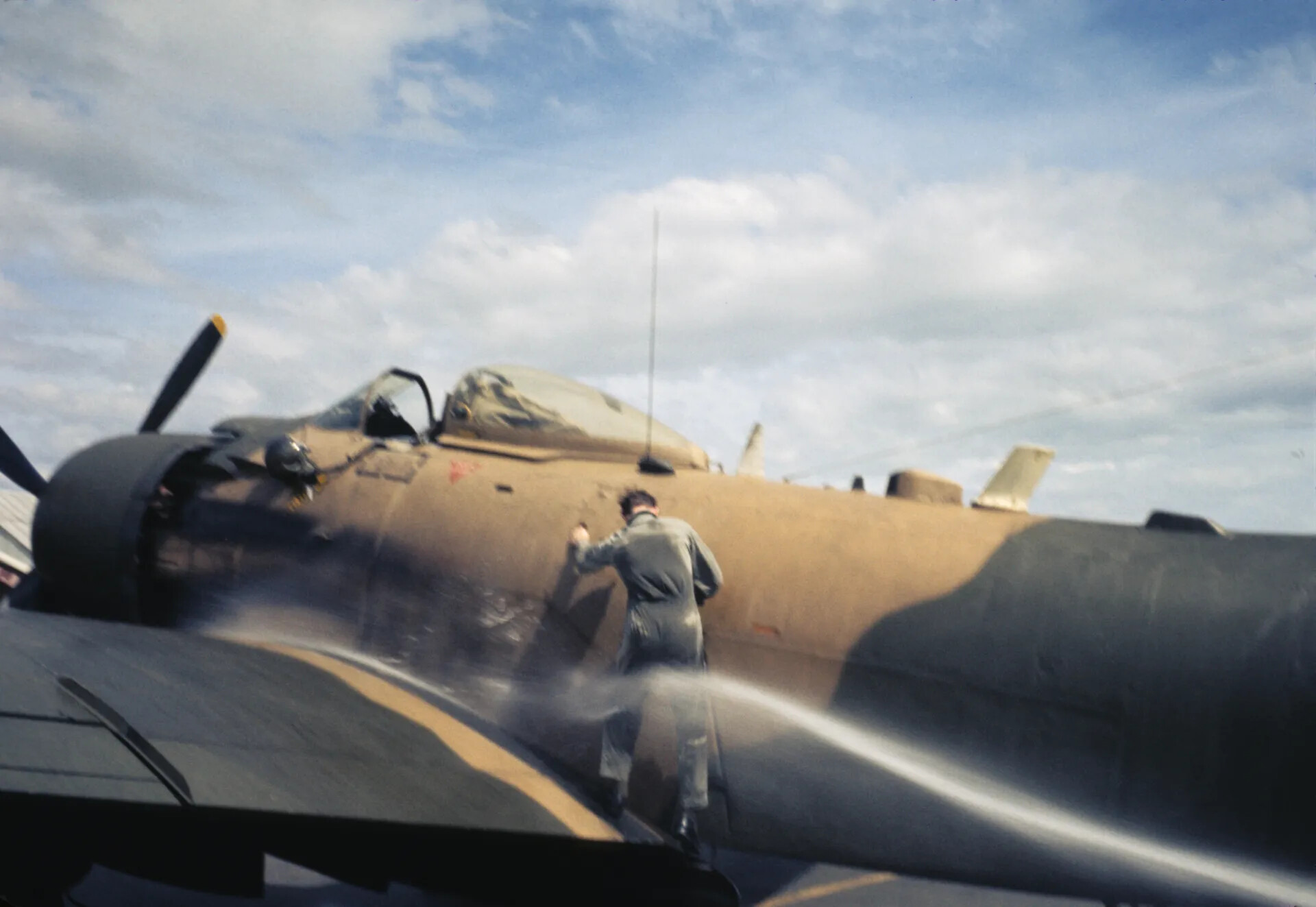 Pilot Being Hosed Down Beside A-1 Skyraider During Fini-Flight Tradition, Vietnam War