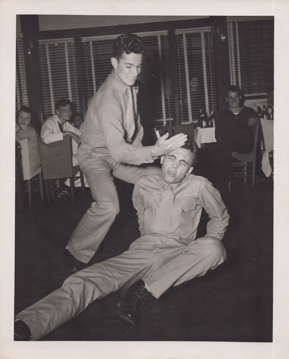 Servicemen Horseplay at Recreation Hall or Club, WWII Era