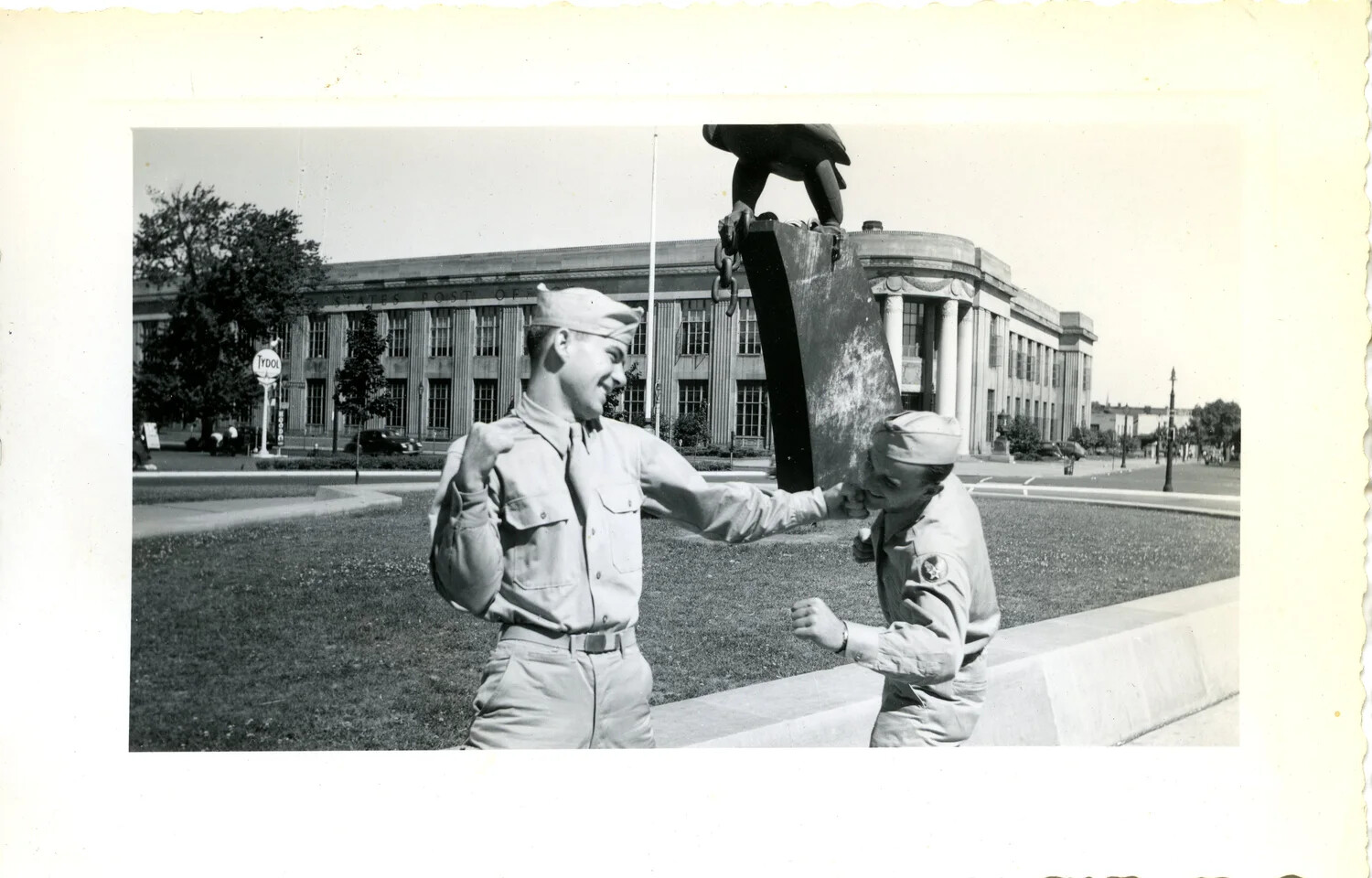 Two Servicemen Mock-Boxing Before Eagle Monument and U.S. Post Office, WWII Home Front