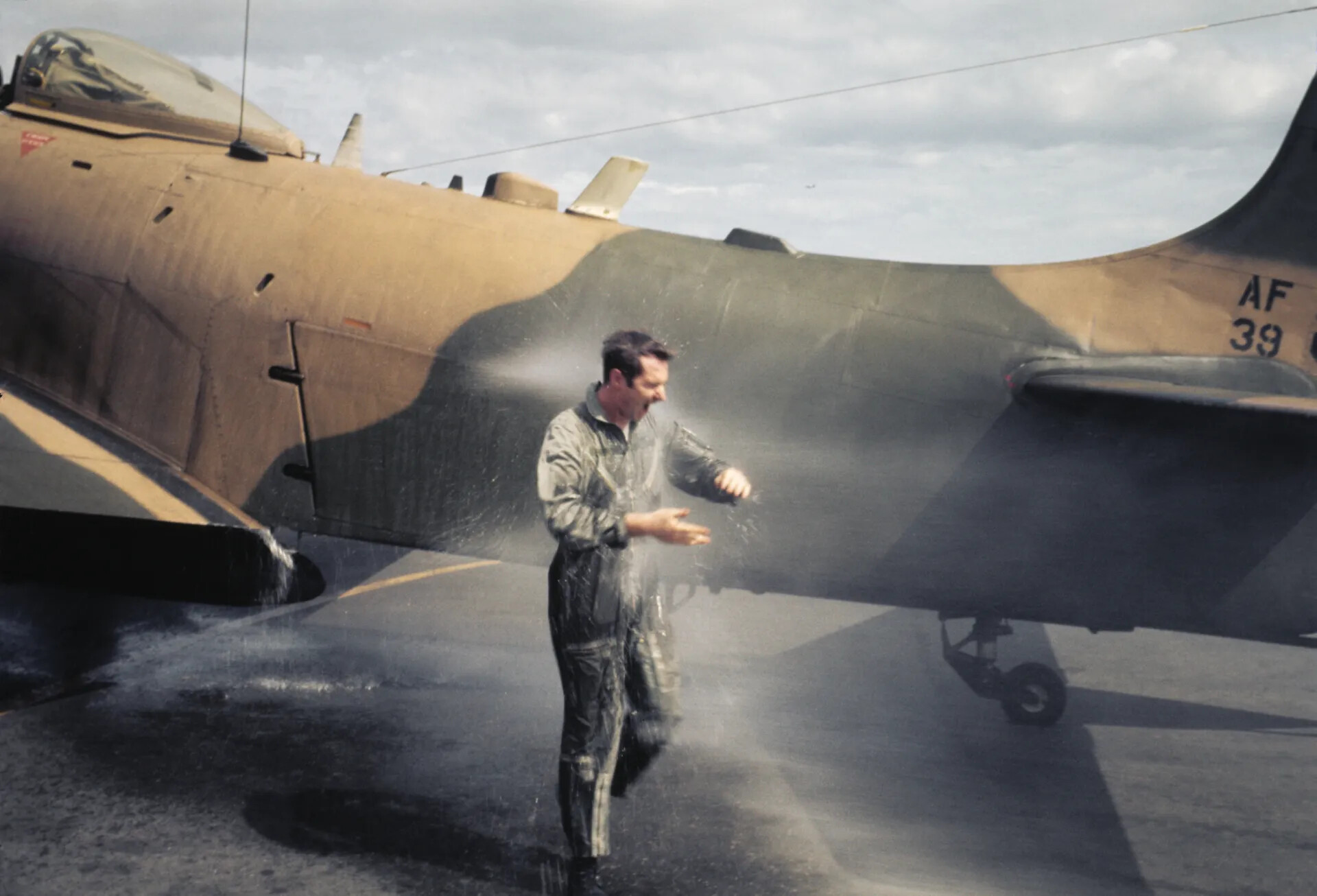 USAF Pilot Shaking Off Water After Wetting-Down Ceremony, A-1 Skyraider 'AF 39,' Vietnam War