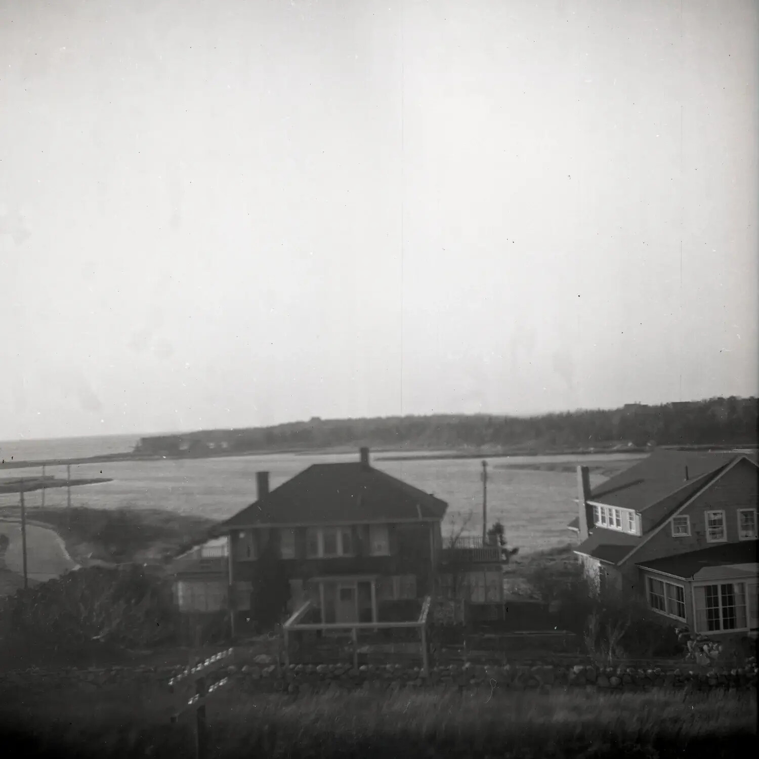Elevated View of Coastal Houses Overlooking a Salt Marsh and Shoreline