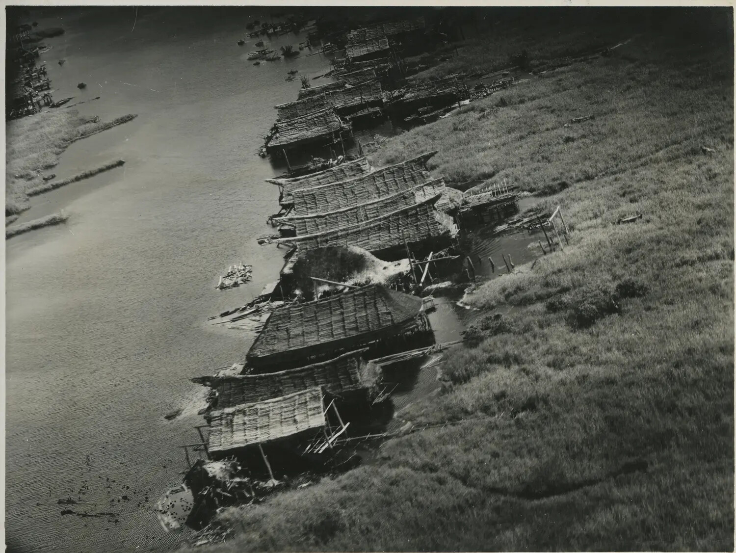 Aerial View of Riverside Stilt Settlement, Southwest Pacific Area, World War II Era