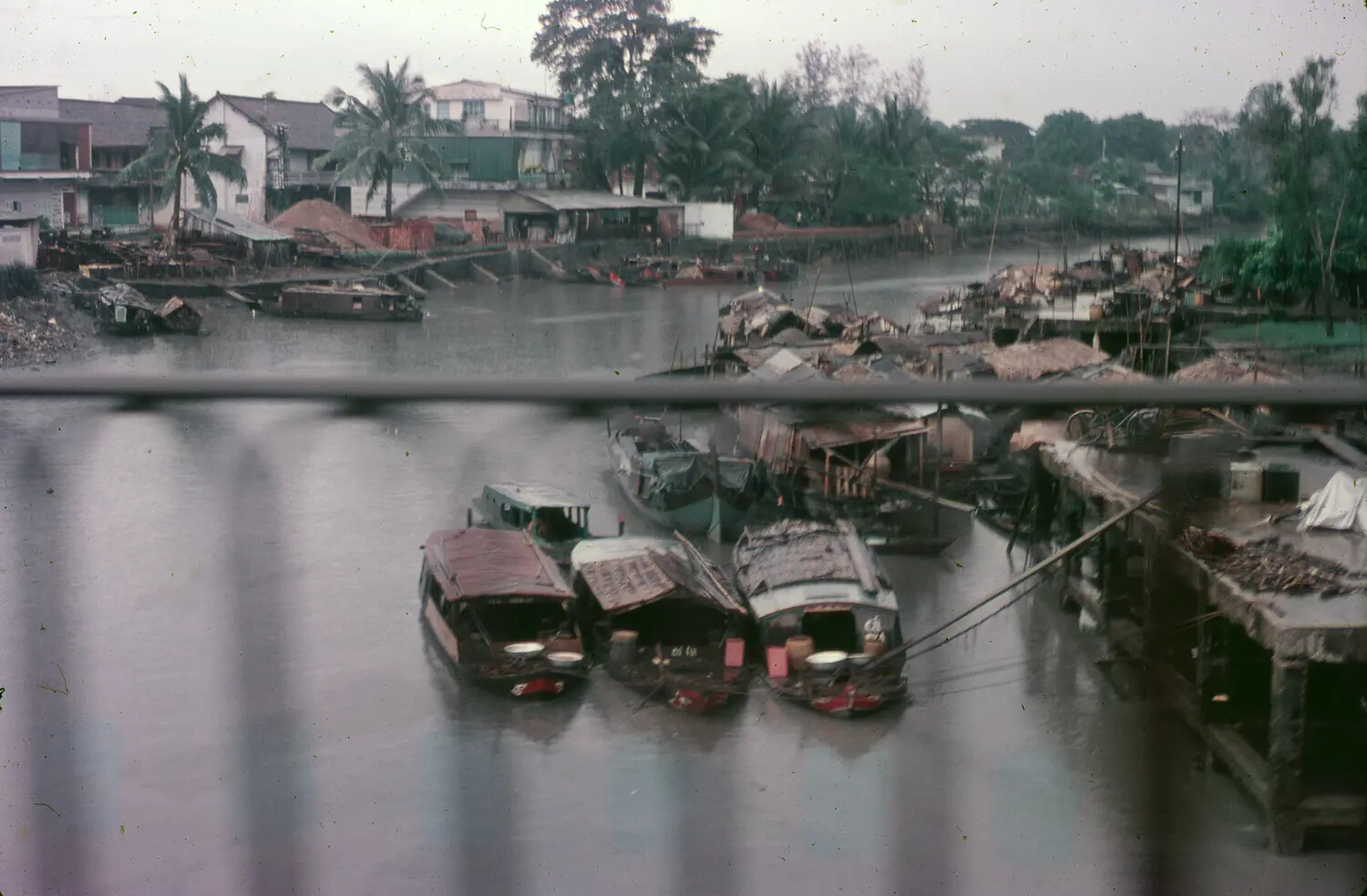 Riverside Sampans and Waterfront Housing, Vietnam, 1965