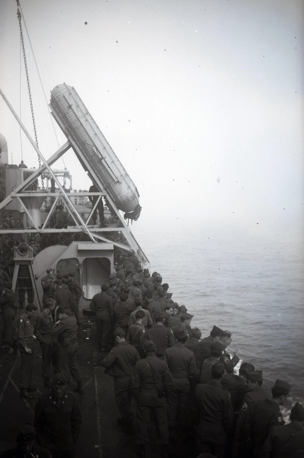 Soldiers Gathered on Deck of a Troop Transport Ship at Sea, WWII Era