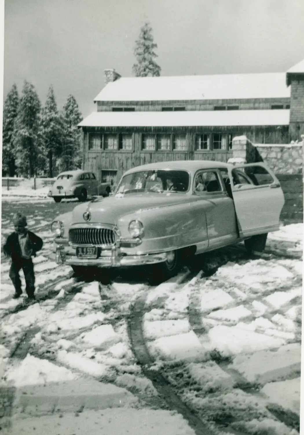 Postwar Sedan and Lodge in Snow, Mountain Resort Setting