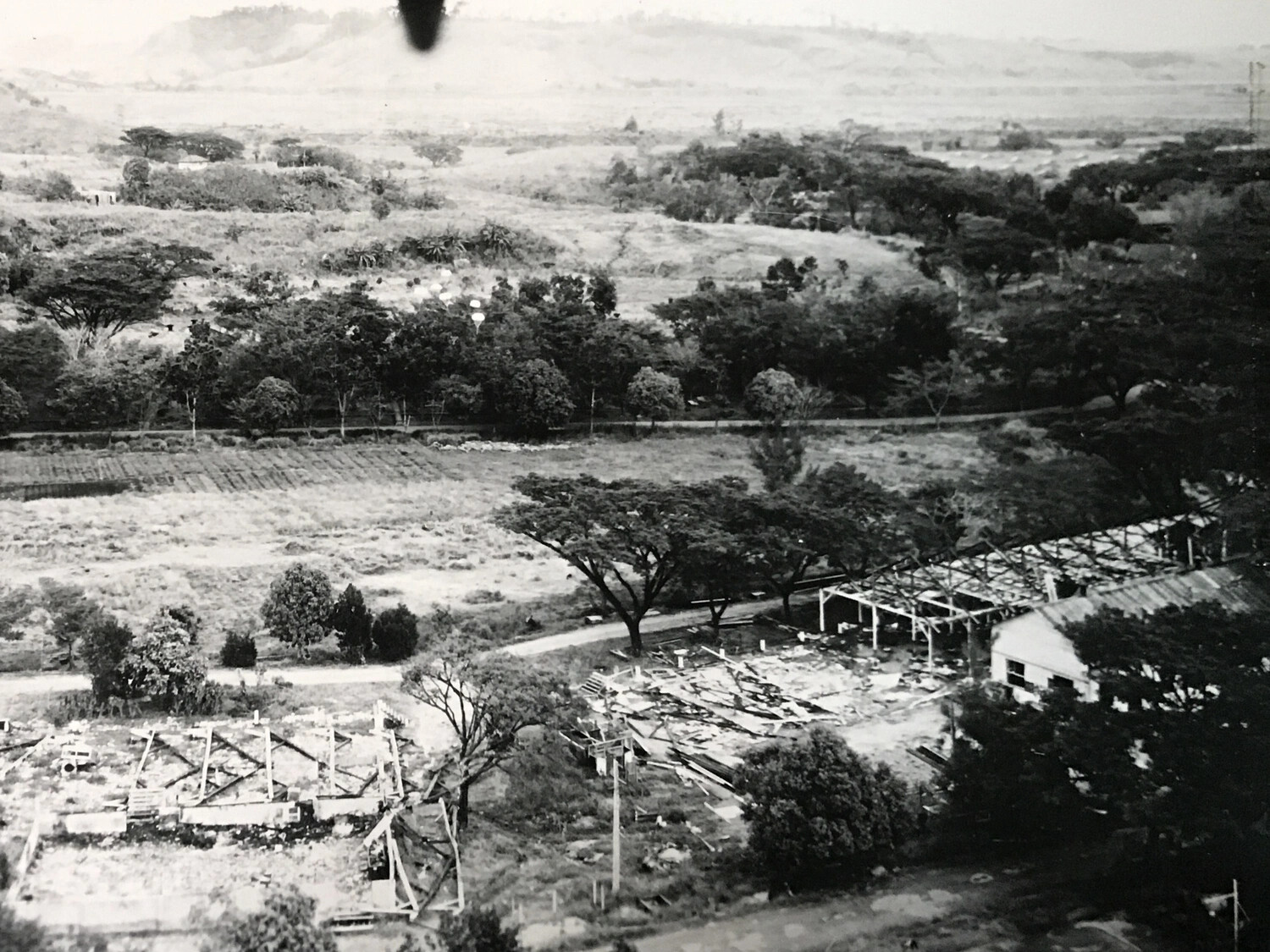 Aerial View of Damaged Base Structures Amid Cultivated Fields, Pacific Theater