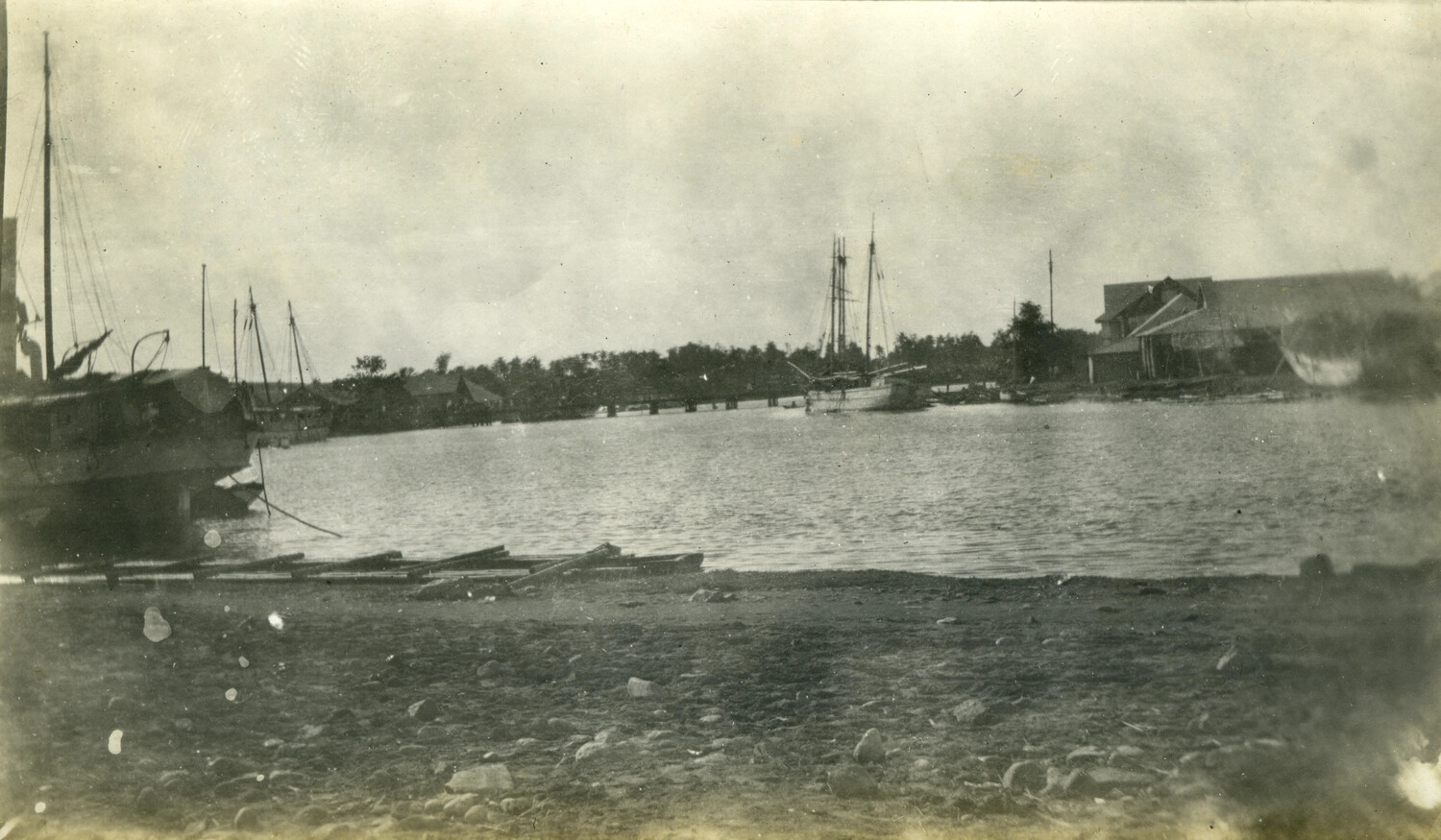 Riverside Harbor Scene with Sailing Vessels and Warehouse, Philippines, Early 1900s