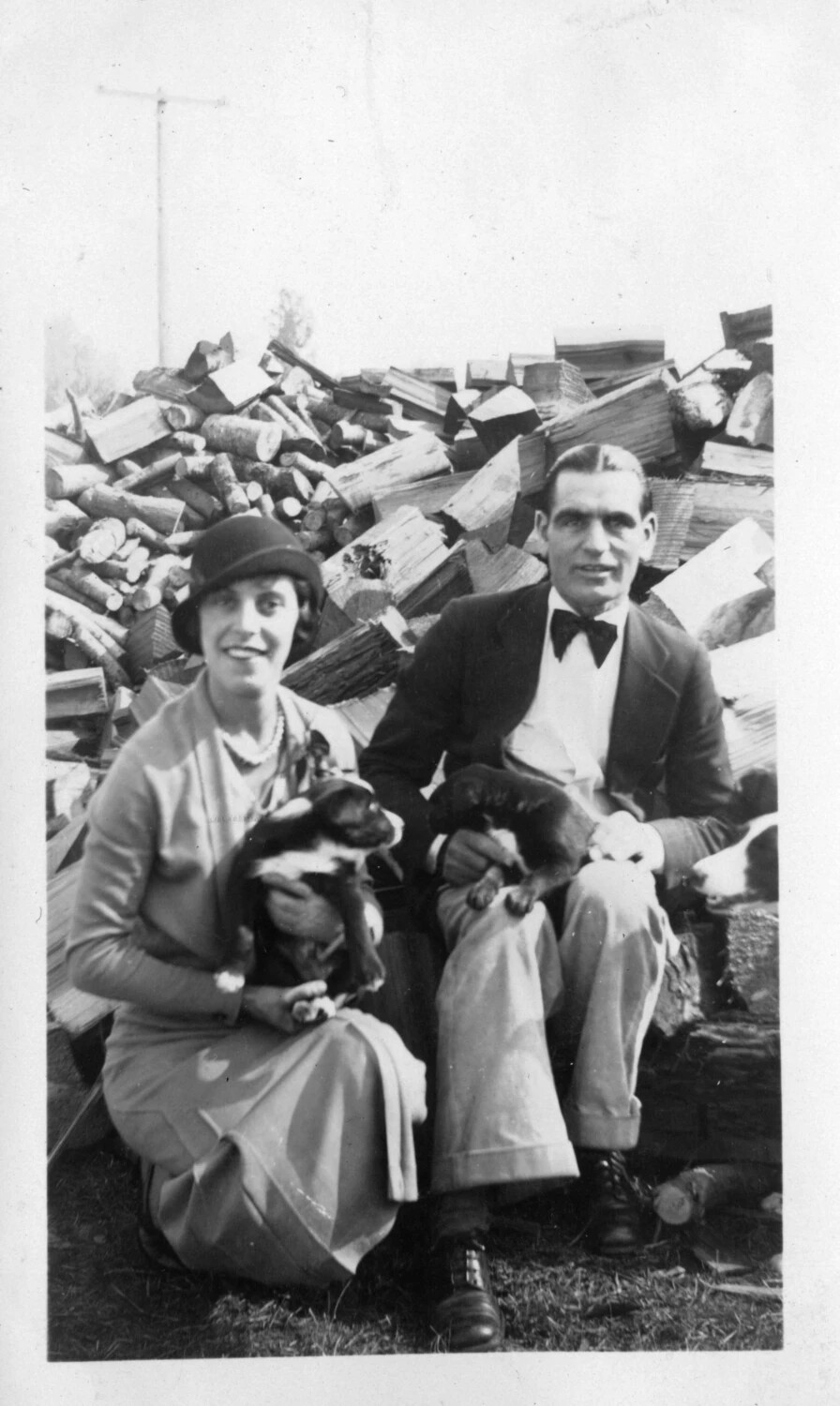Couple with Puppies Before Woodpile, Presidio Album, 1920s
