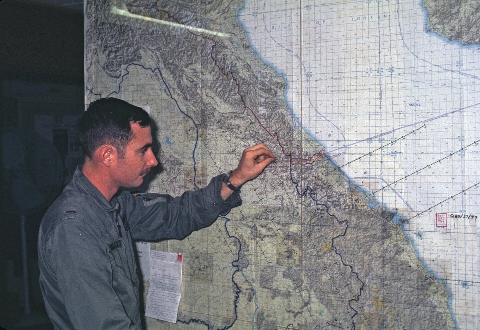Airman Briefing at Wall Map of North/South Vietnam Coastline