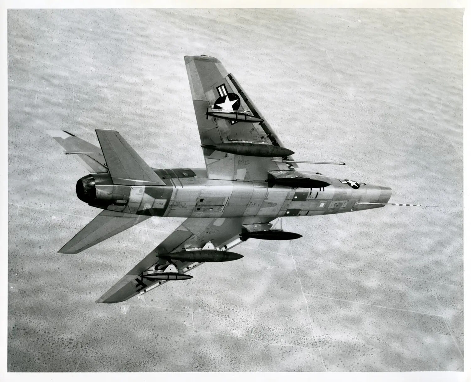 USAF Swept-Wing Jet Fighter-Bomber in Banked Turn with External Ordnance