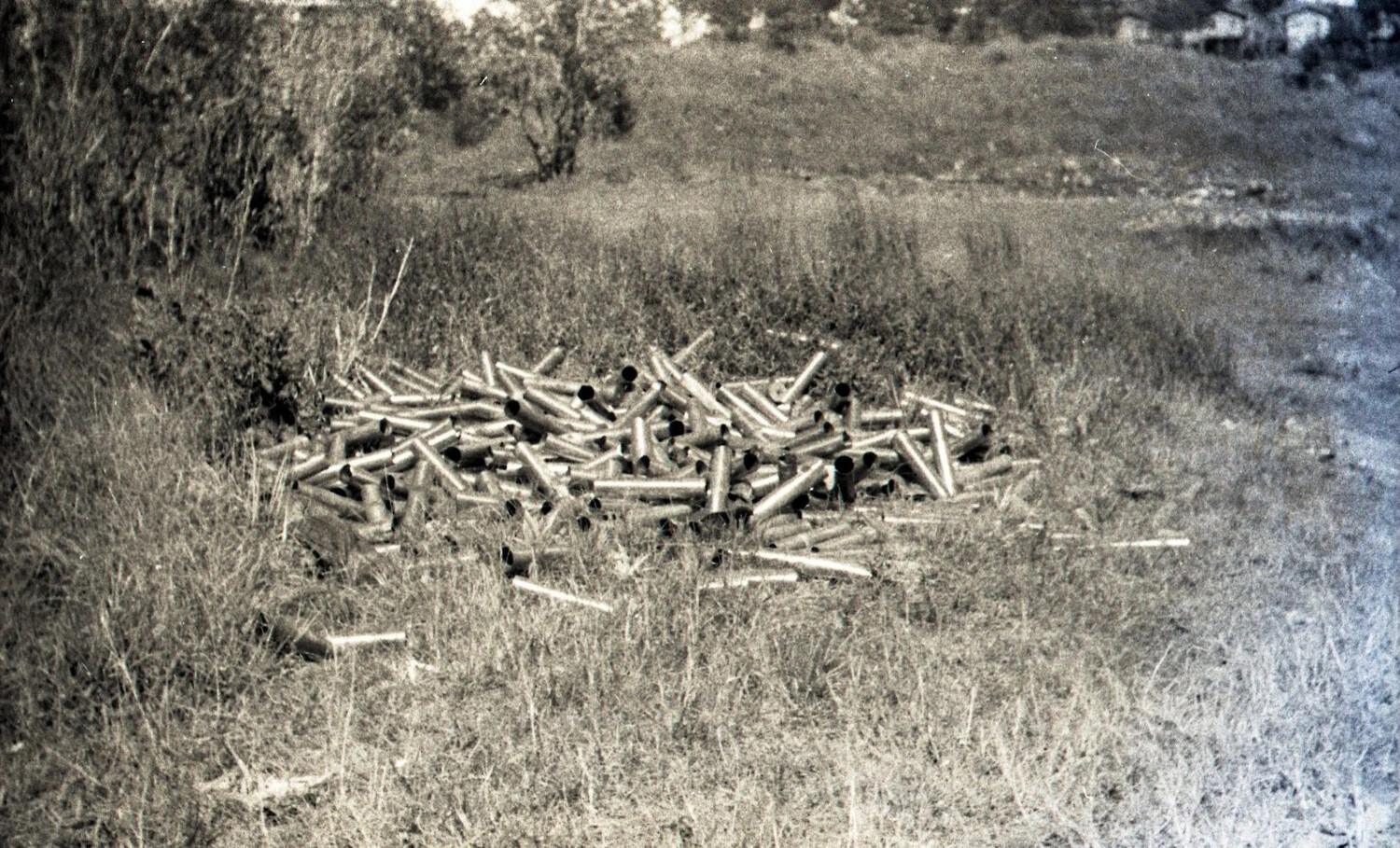 Pile of Spent Artillery Shell Casings in Field, Luzon, Philippines, World War II