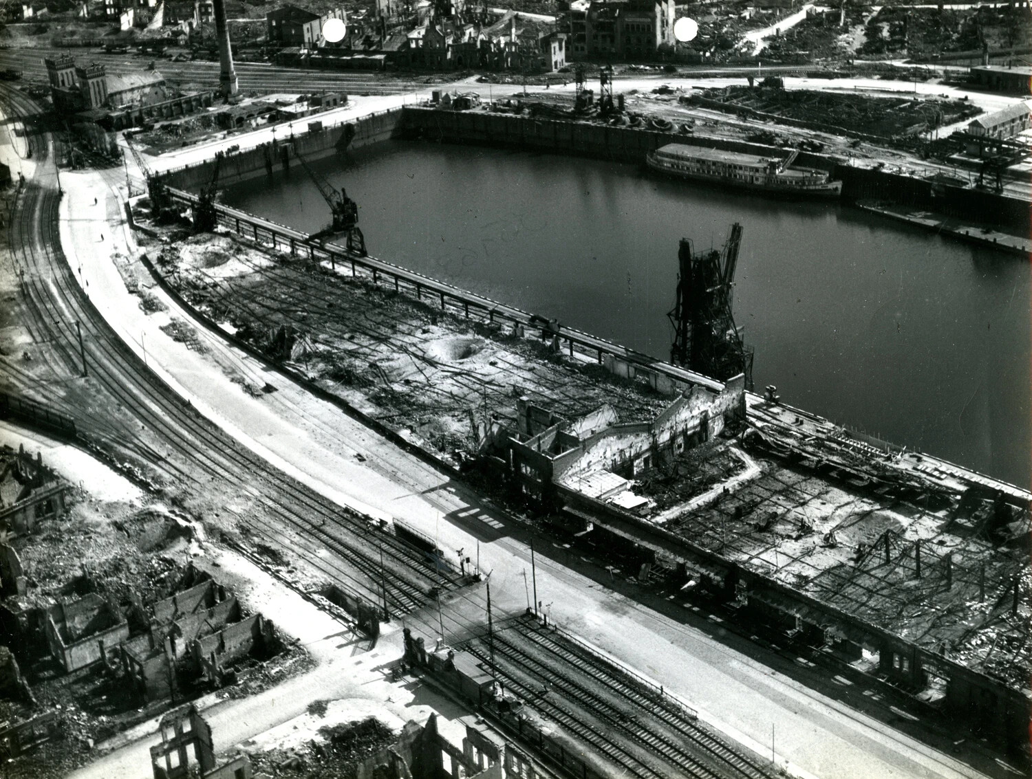 Aerial Reconnaissance Photograph of Bombed Harbor and Rail Yard, European Theater - 11th Armored Division Collection