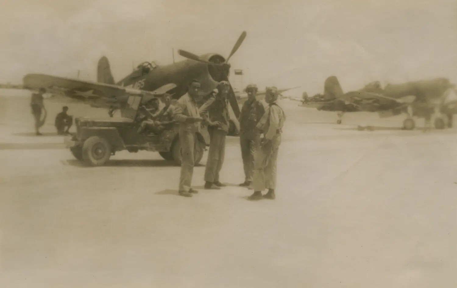 Marine Aviators with F4U Corsair Fighter and Jeep on Pacific Airfield, WWII — McAleer Collection