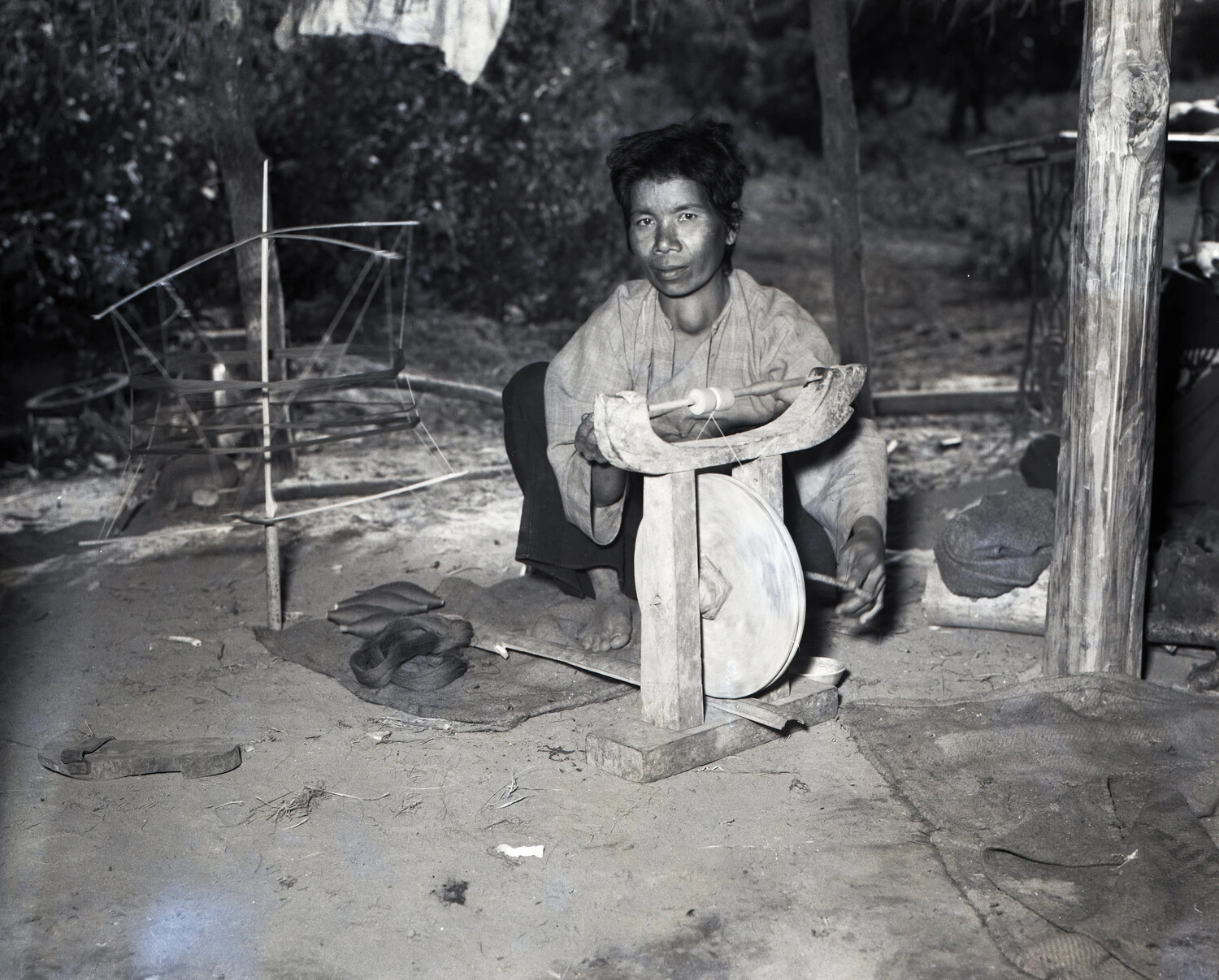 Burmese Woman Hand-Spinning Thread on a Traditional Wooden Spinning Wheel, CBI Theater, WWII