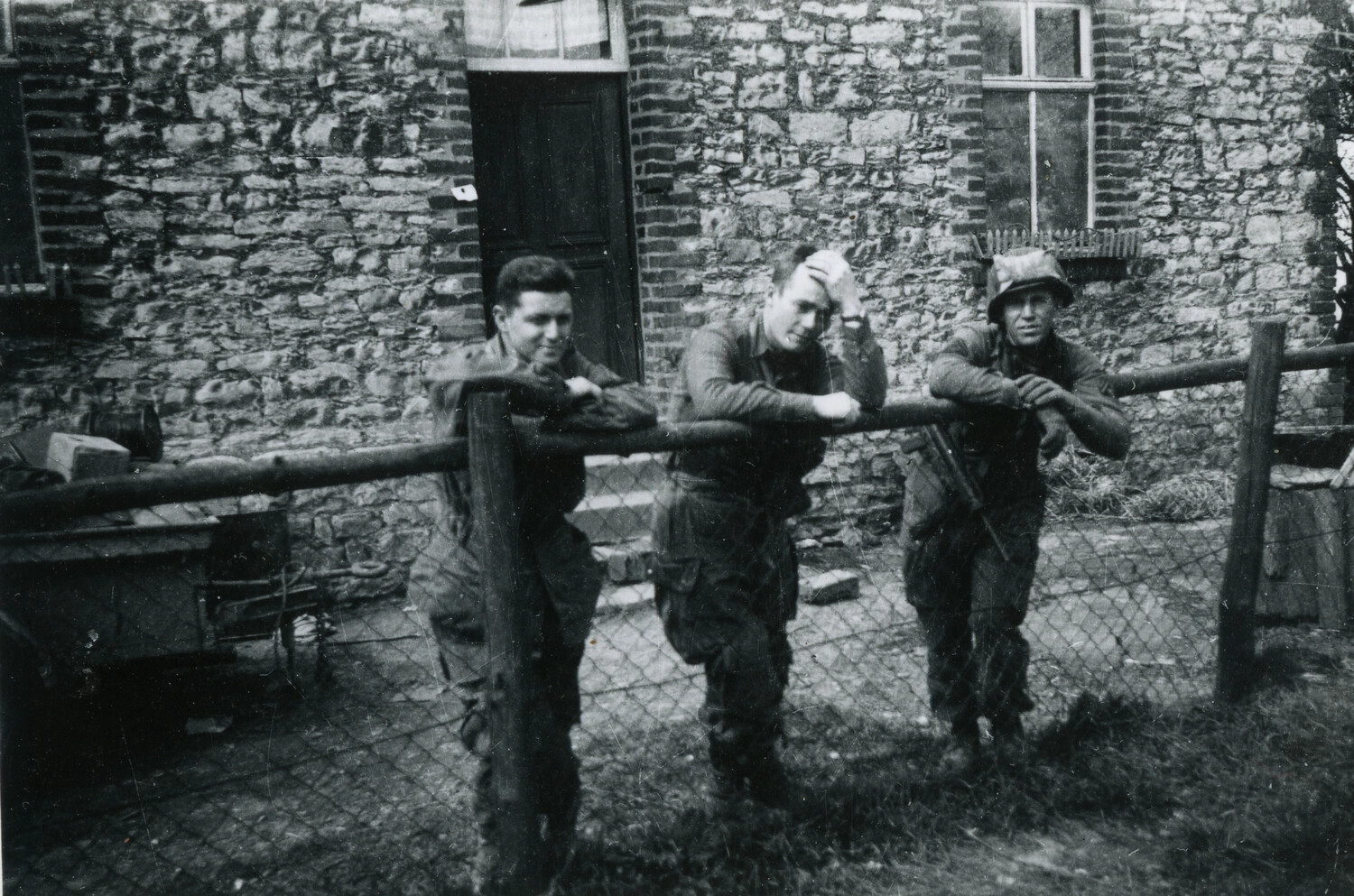 Three 101st Airborne Paratroopers Resting at a European Farmhouse, WWII