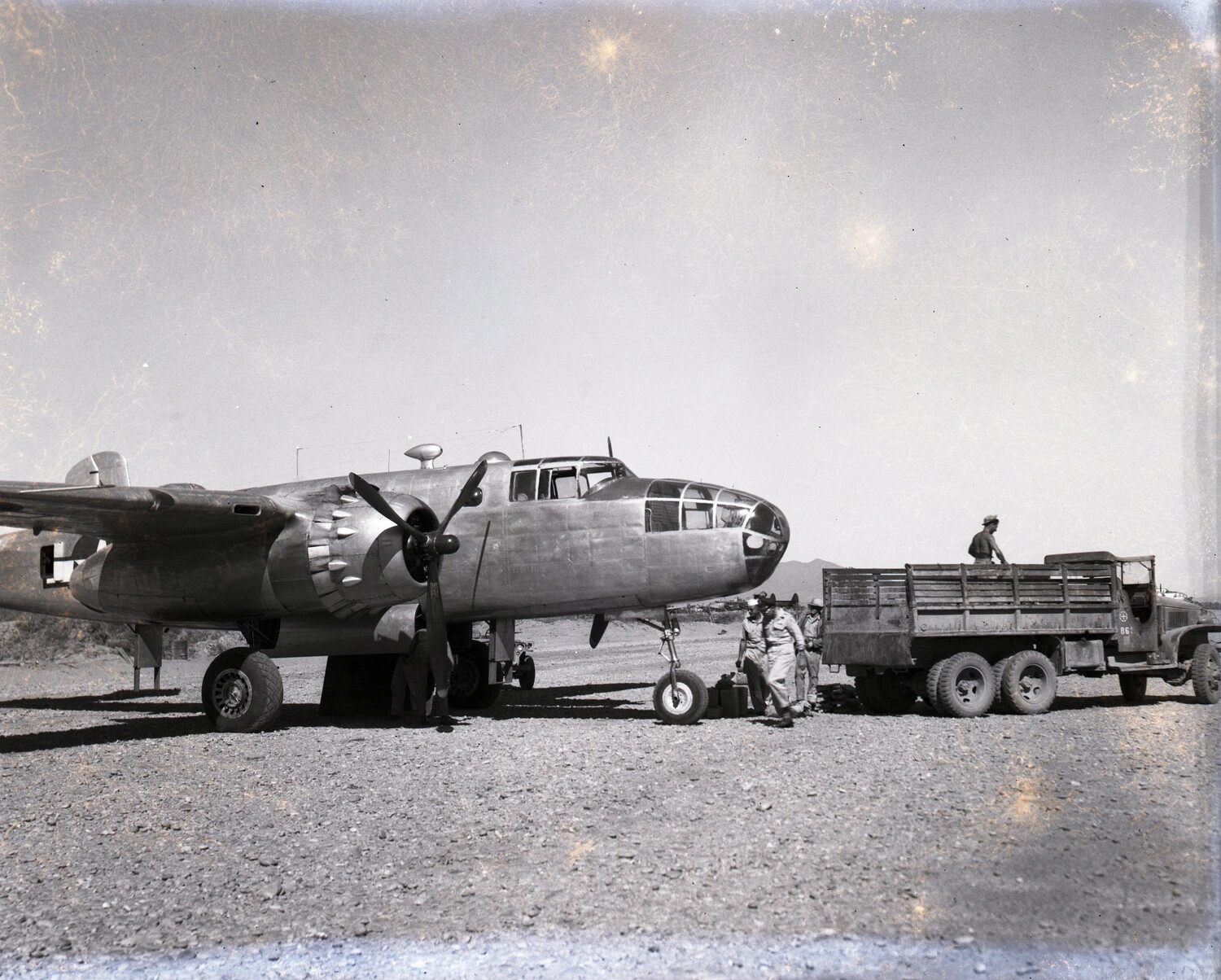 North American B-25 Mitchell Bomber with Ground Crew and Cargo Truck, Burma, WWII