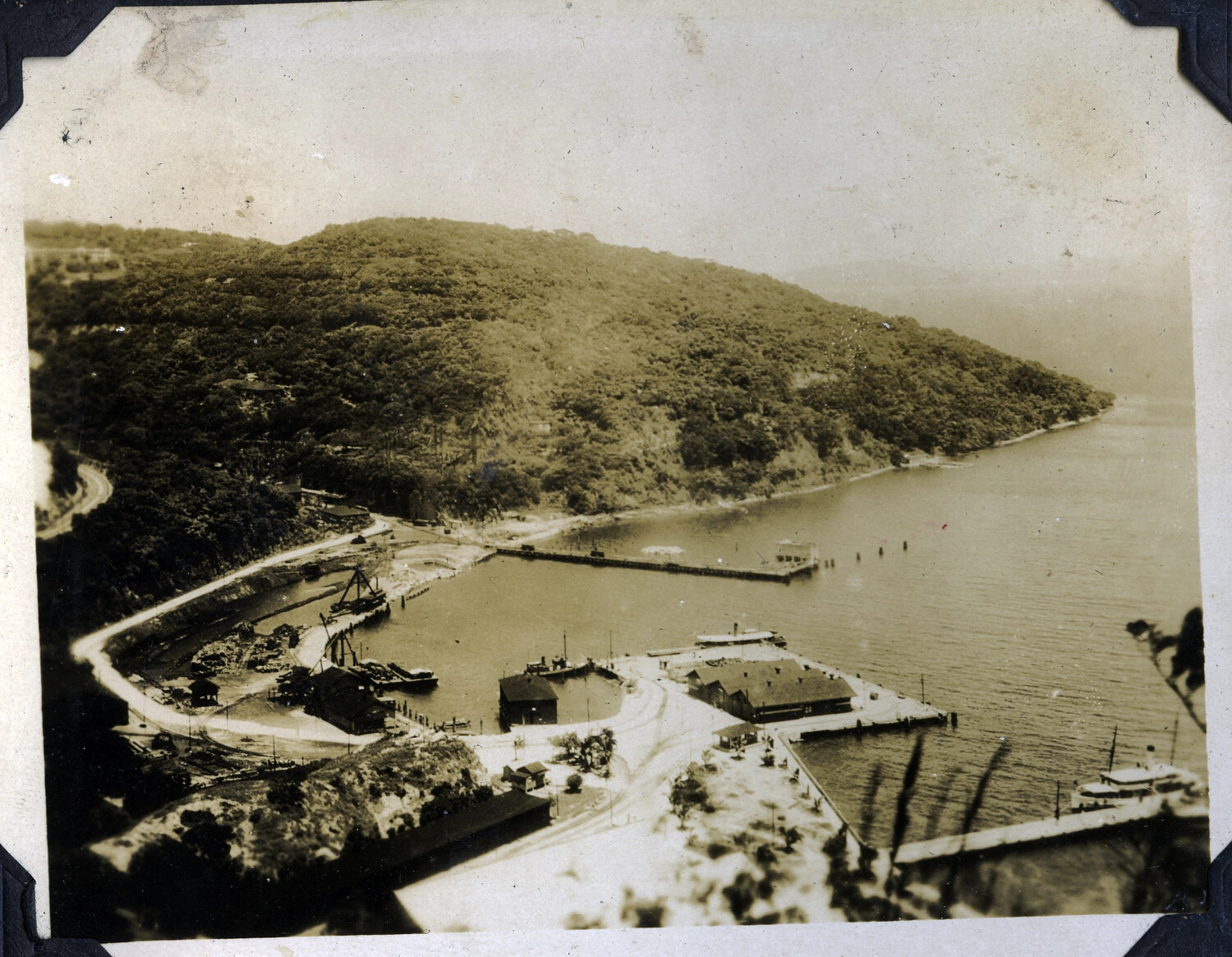 Elevated View of Harbor and Dock Facilities Beneath a Forested Headland, Manila Bay Area, Philippines