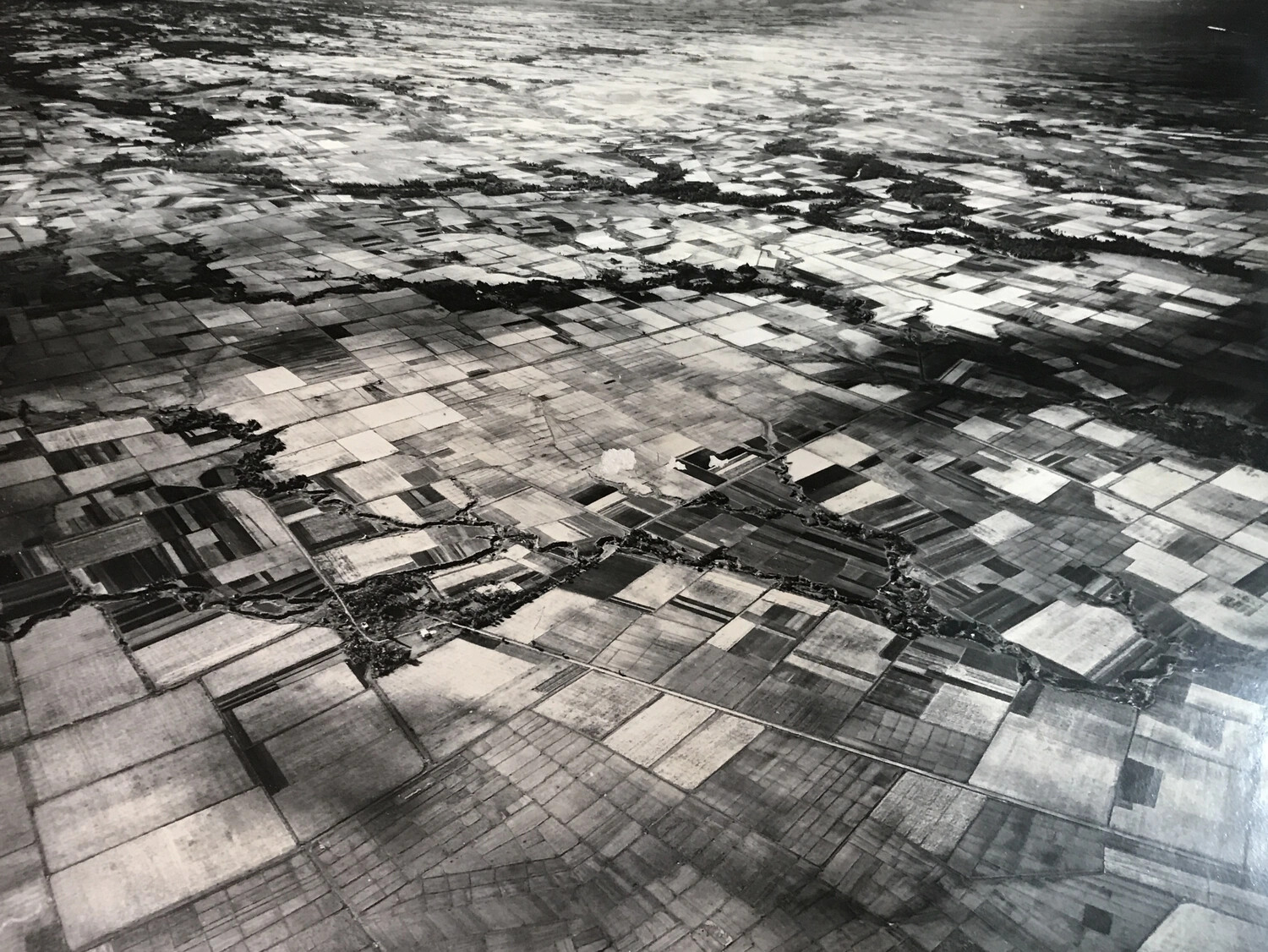 High-Altitude Aerial Photograph of Agricultural Terrain with Bomb Strike, Pacific Theater, WWII