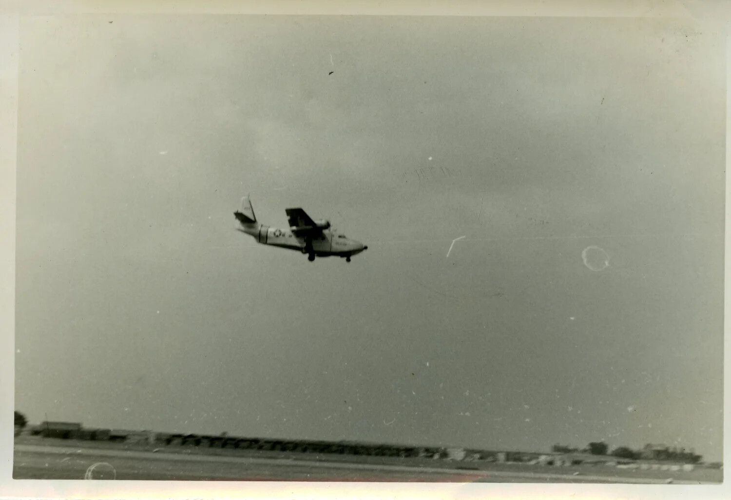 Twin-Engine Amphibious Aircraft on Approach, Overseas U.S. Air Base