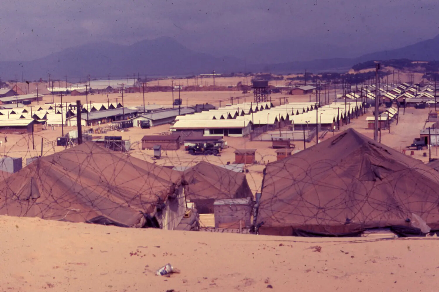 Vietnam War Era Color Slide: Elevated View of Barracks Rows, Water Tower, and Perimeter Wire, Cam Ranh Bay, Vietnam