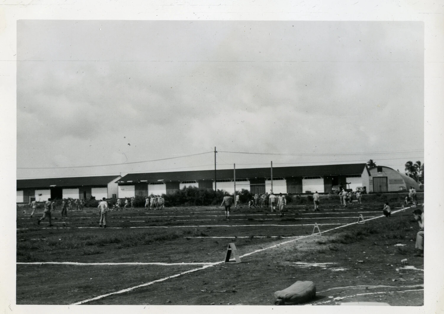 Servicemen Playing Ball on Airfield Grounds, NATS Squadron VR-6, Agana, Guam