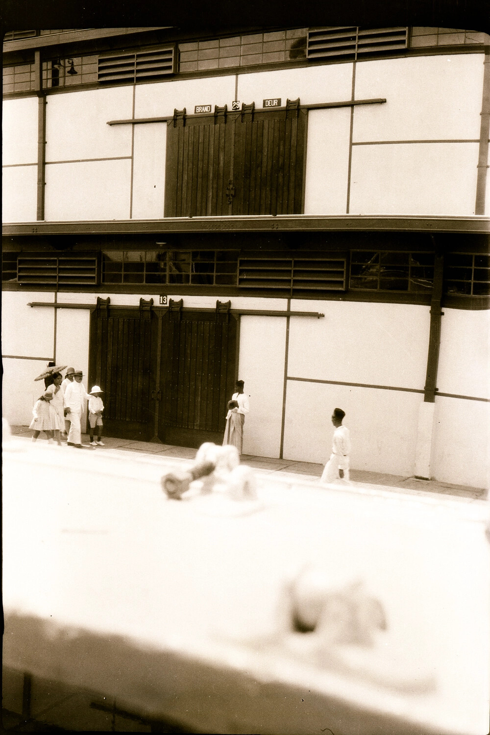 Dockside Warehouse with Dutch 'Brand Deur' (Fire Door) Signage, Netherlands East Indies, 1930s (U.S. Navy China/Pacific Cruise Album)