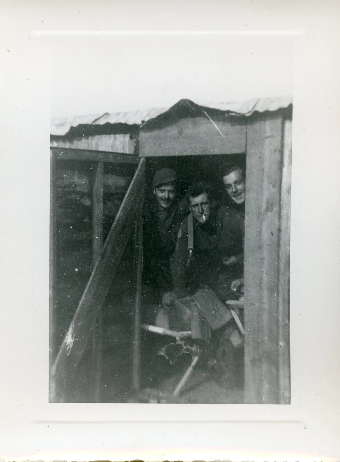 Three Servicemen at Shelter Doorway, Aleutian Islands, World War II