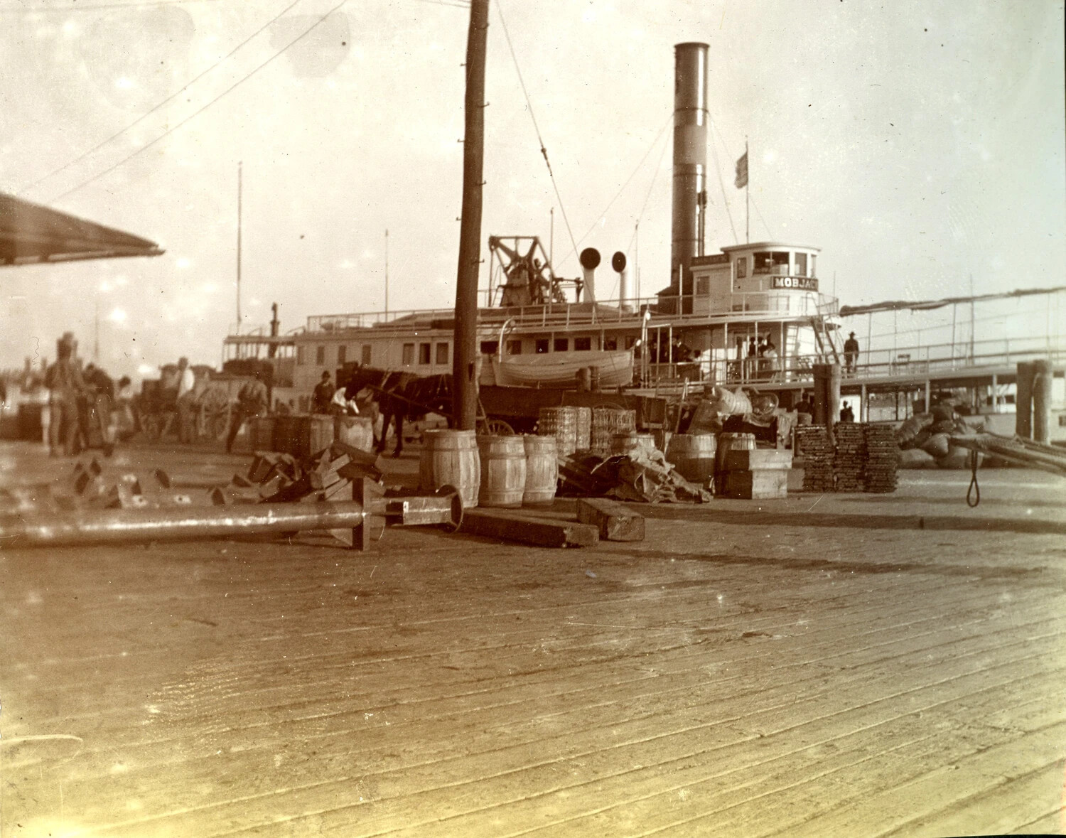 Side-Wheel Steamer MOBJACK Loading Cargo at a Chesapeake Bay Wharf, c. 1900s