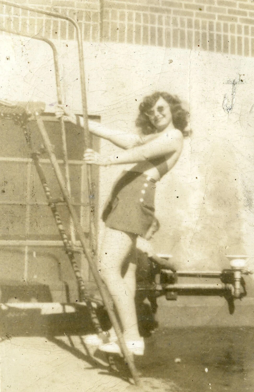 Personal Snapshot of a Young Woman in Swimwear (VMF-214 Album, WWII Era)