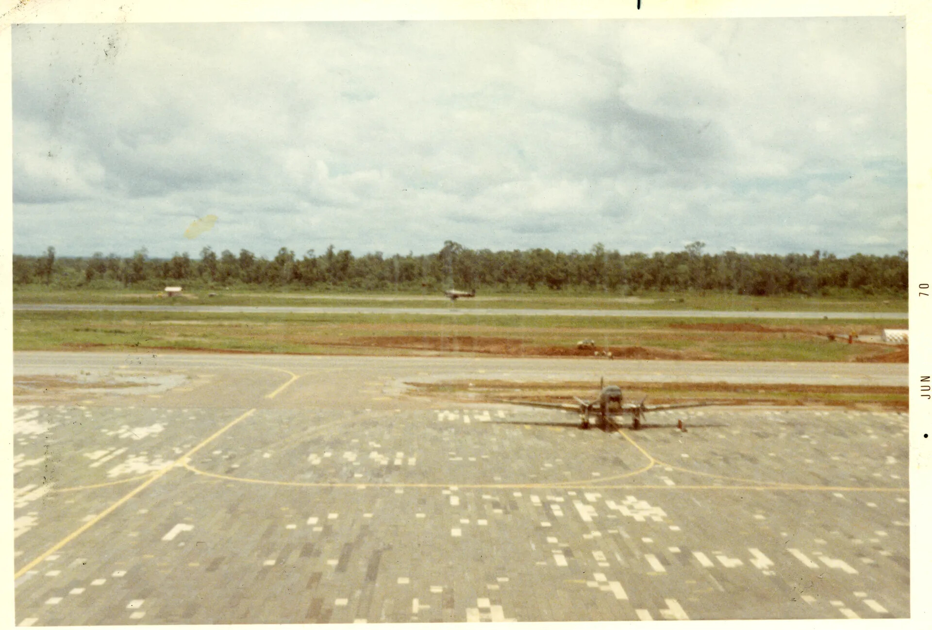 C-123 Provider on Ramp with Aircraft on Runway, NKP RTAFB, June 1970