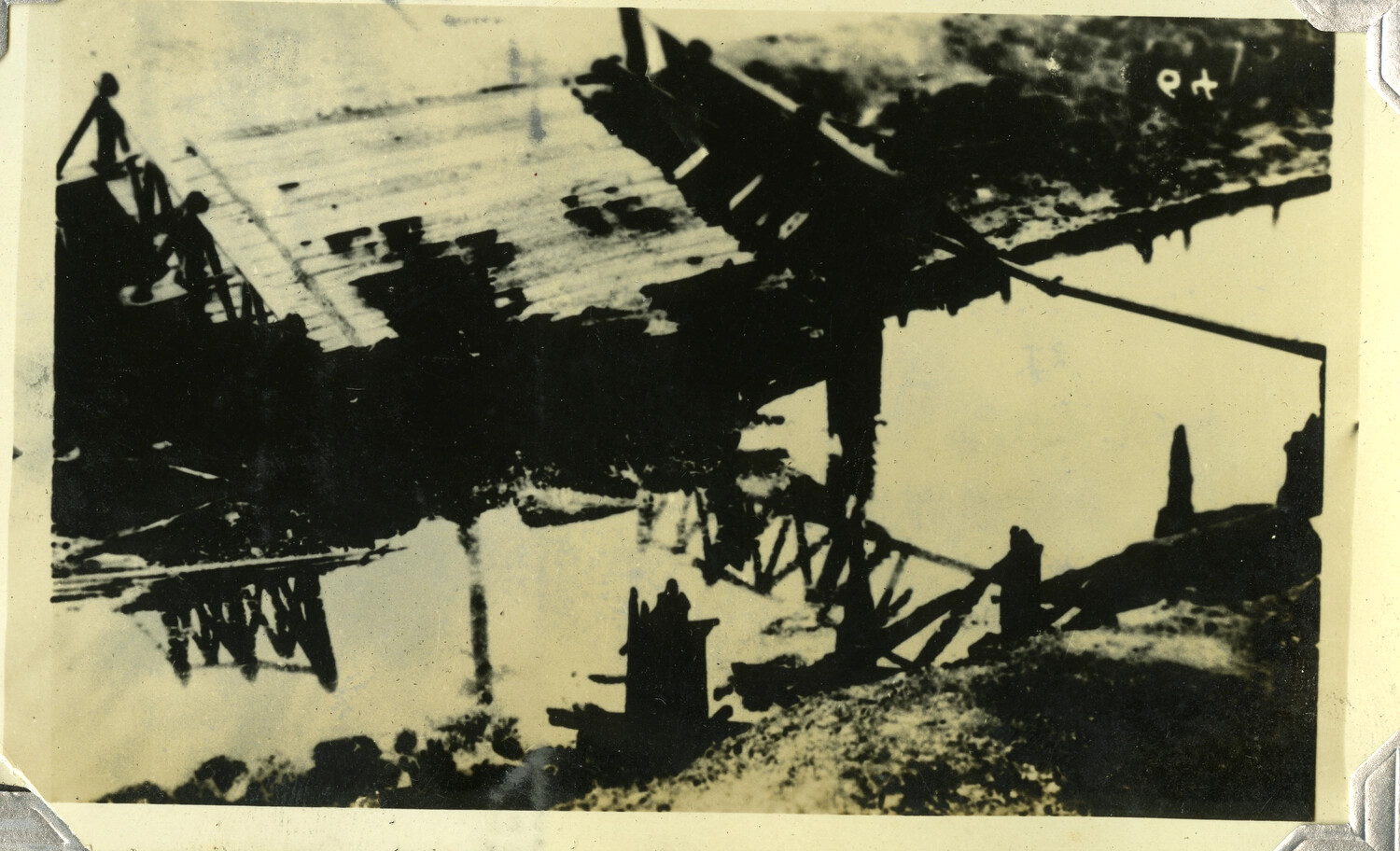 Destroyed Wooden Trestle Bridge Over Water, c. 1930s